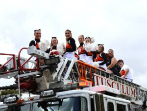 The Tusculum cheer team generates enthusiasm during the Homecoming parade in 2023.