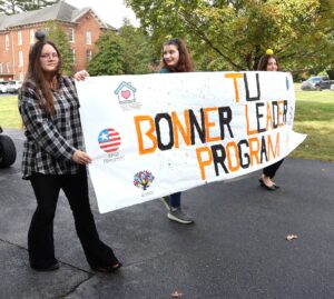 Members of the Bonner Leader Program walk in the parade.