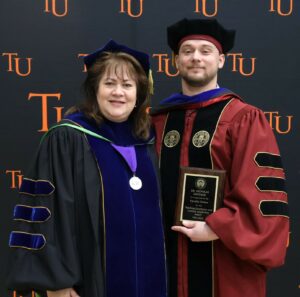Dr. Tricia Hunsader, left, Tusculum’s provost, stands with Dr. Nick Davidson, chair of the Sport Management Department.
