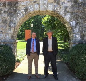 Dr. Scott Hummel, left, and Mishi Neubach stand in front of the Tusculum Arch in 2022.