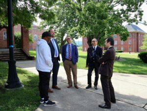 Tusculum leaders gave their Japanese guests a tour of campus. Left to right are Robert Williams, Tusculum’s track and field head coach; Dr. David Cook, provost and vice president of academic affairs; Dr. Hummel; Daryoosh Matsudaira, principal of Kanto International Senior High School; and Shinichiro Yamamoto, director of the English course at Kanto.