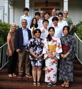 Kanto students and one of their teachers take a photo with their teachers at Tusculum and university administrators after dinner at the President’s House.