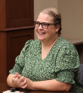 Nicole Cook watches one of the student presentations.