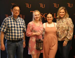 Angela Sanchez, second from the right, honored, left to right, Dr. Harold Branstrator, Cheyenne Hewitt and Trea King.