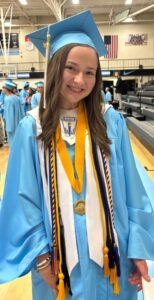 Mary Anne Cooper wears her graduation attire for commencement at Gibbs High School.