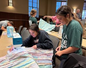 Two Tusculum students enjoy the quilt top project during Nettie Day.