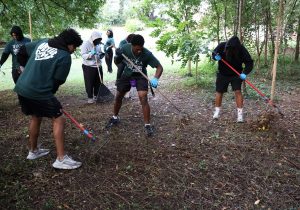 Tusculum students help clean property in the community.