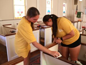 Tusculum students clean inside Asbury United Methodist Church.