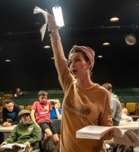 Rachel Lawrence, who plays the female lead, rehearses a scene for “Newsies.” Photo from Kristin Girton