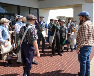 Steve Schultz, right, speaks with newsies at the Greeneville Commons.