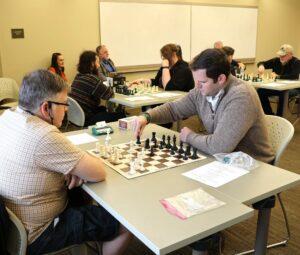 Some of the competitors play chess during Pioneer CON.