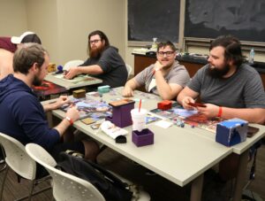 Competitors play Magic: The Gathering.