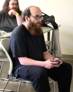Dakota Hammonds, front, a Tusculum University alumnus, plays Super Smash Bros. He won that tournament.