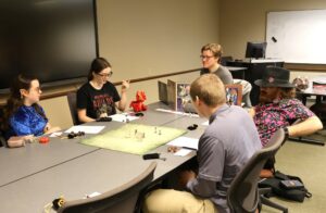 A group plays Dungeons and Dragons.