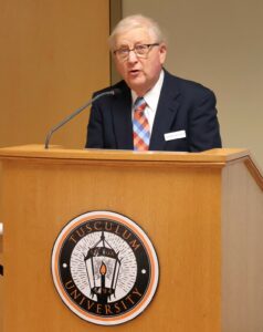 Rick Raum speaks during the Pioneer Promise dinner.