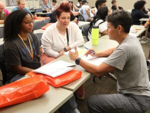 Dr. Suzanne Byrd, right, chair of the Sport Science Department, speaks with a new student.