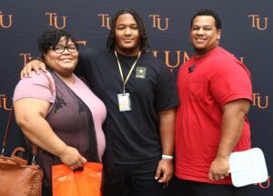 New student Jorryn Griffin, middle, stands with his parents, Zachary and Jahonna Griffin.