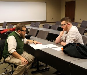 Steve Schultz, left, helps a student with his schedule.