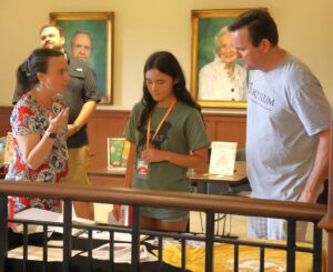 Dr. Shelby Ward, left, assistant professor of political science and director of the Center for Civic Advancement, speaks with new student Ellie Bielenda, middle, about the Bonner Leader Program, a service group on campus.