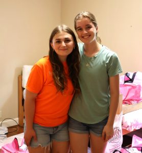 Ana Kotynski, right, and Danielle Dugger enjoy a moment after moving into the women’s house of the Discipleship Living-Learning Center.