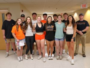 Many of the students who are residing in the Discipleship Living-Learning Center pose together after moving in to their respective houses. Standing on the right is the Rev. E.J. Swatsell, director of spiritual life and special projects.