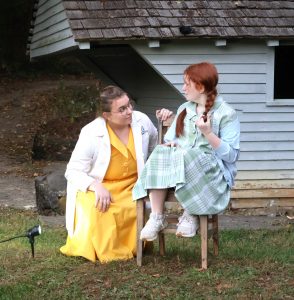 Two actors perform in a play during “Edgar Allan Poe and Other Haunted Stories in the Woods” in 2024.