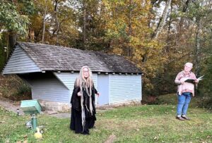 Actors perform on the grounds of the Doak House Museum during “Edgar Allan Poe and Other Stories in the Woods” in 2023.