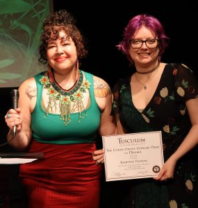 Kiersten Paxton, right, receives one of her awards.