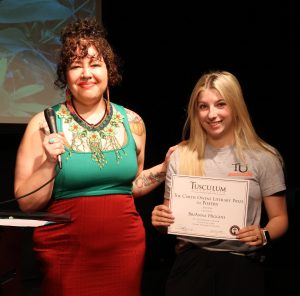 BriAnna Higgins, right, celebrates her prize.