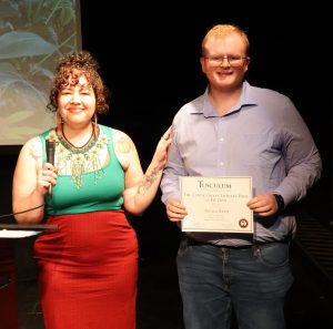 Austin Reed, right, receives his award.