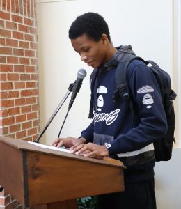 Tusculum student Paul Nwigwe reads during the 2025 event at the university.