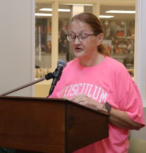 Student Dolly Holt reads during the 2025 event.