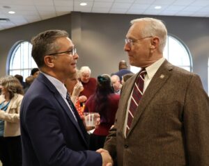 Dr. Scott Hummel and Dr. Scott Niswonger, a Tusculum Board of Trustees member, greet each other.