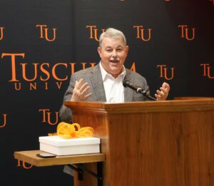 Dr. Greg Nelson speaks during the ceremony.