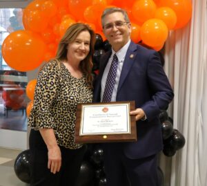 Patty Mills, left, a representative of Congresswoman Diana Harshbarger’s office, presented a certificate of special congressional recognition to Dr. Scott Hummel,