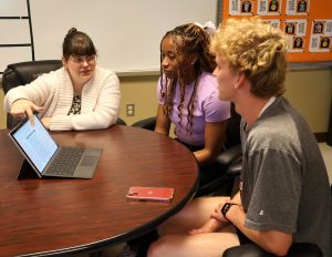 Meagan Stark, associate director of SSS, counsels members Jahzara Hart, middle, and Jerry Ricker.