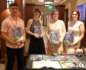 The editorial staff included, left to right, JP Campione, Isabella Gall, Kiersten Paxton and Lily Burgner. They are holding copies of “Sit Lux.”