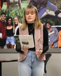 Student Elizabeth Massengill reads her poem published in “Sit Lux” at the creative writing readings activity during the Old Oak Festival.