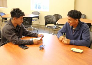 Students conduct practice interviews.