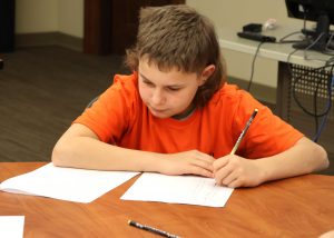 A student competes in the Academic Bowl.