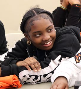 A student has a good time during the Scholars Bowl