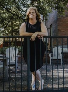 Elizabeth Tarlton takes a photo at Virginia Hall on campus. Photo by Hannah Vaughn
