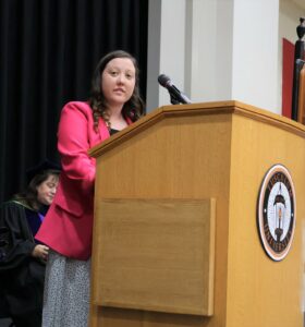 Maggie Vickers, president of the Student Government Association, speaks during the Opening Convocation.