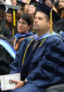 Dr. Brandon Hudson was in the audience for Brandy Thigpen's graduation speech.