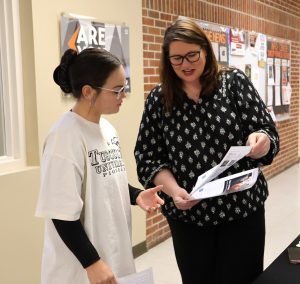 Tiffany Greer, right, speaks with Tusculum student Angela Sanchez.