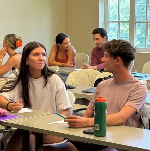 Students work on a project in a sales course on the opening day of classes.