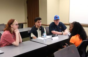 Students introduce themselves to each other in an English class.