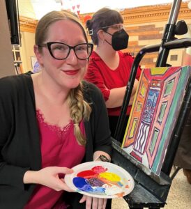 Mikaela Cooney, a Tusculum faculty member, shows her work in progress at the 2023 Valentine’s Painting Night.