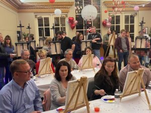 Guests work on their paintings during the 2023 event.