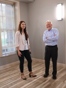 Claire Hensley, left, associate vice president of student affairs and retention, and Jim Durham, a Board of Trustees member, admire improvements to the Stanley R. Welty Jr. Lobby.